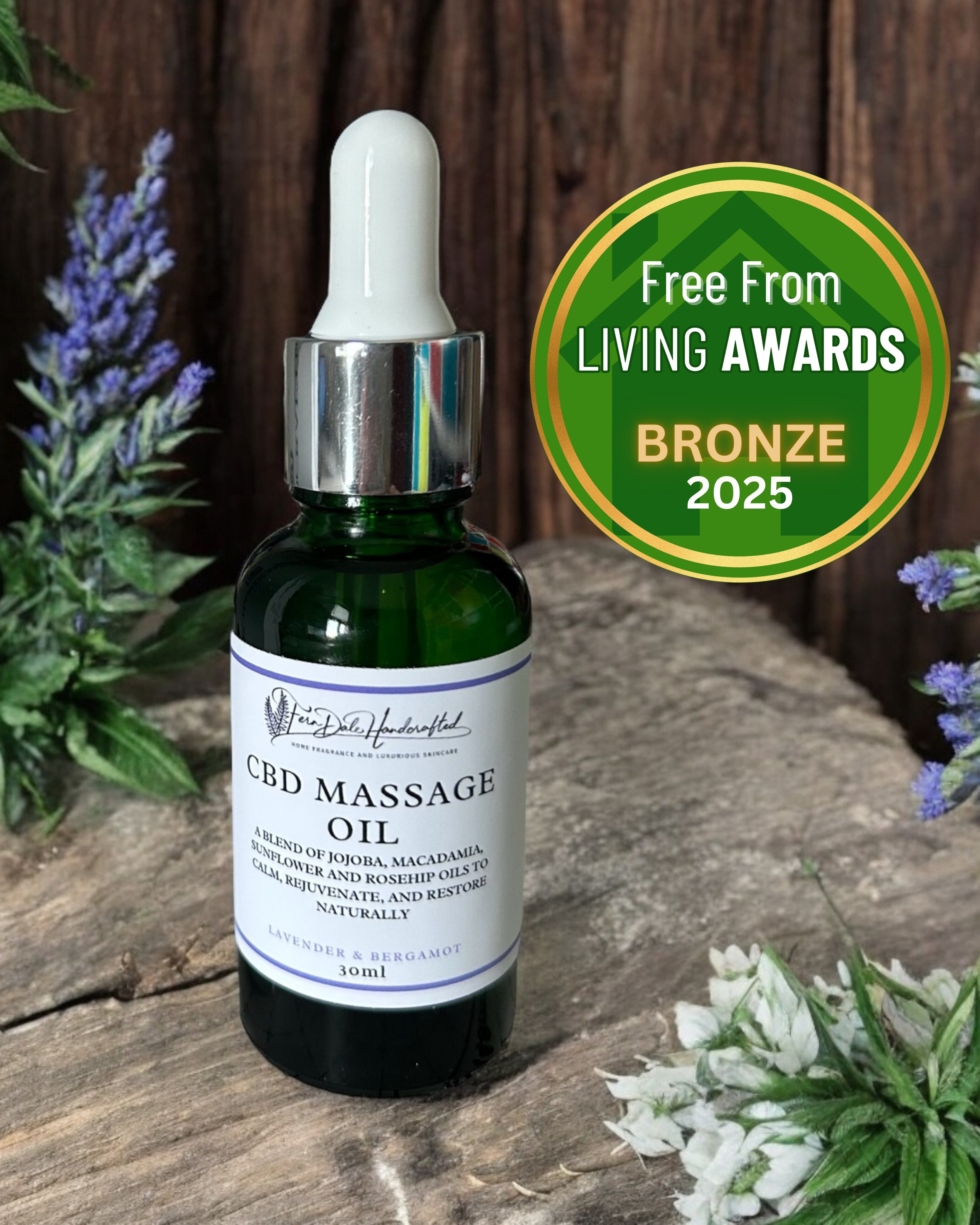 Massage Oil in Lavender & Bergamot in a green dropper bottle beside a Free From Living Awards Bronze 2025 badge.