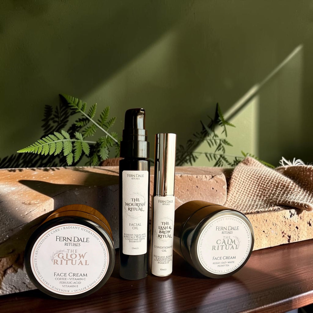 Photo showing 4 facial products in a row starting with the Glow Ritual, The Nourish Ritual, The Lash & Brow Ritual and The Calm Ritual